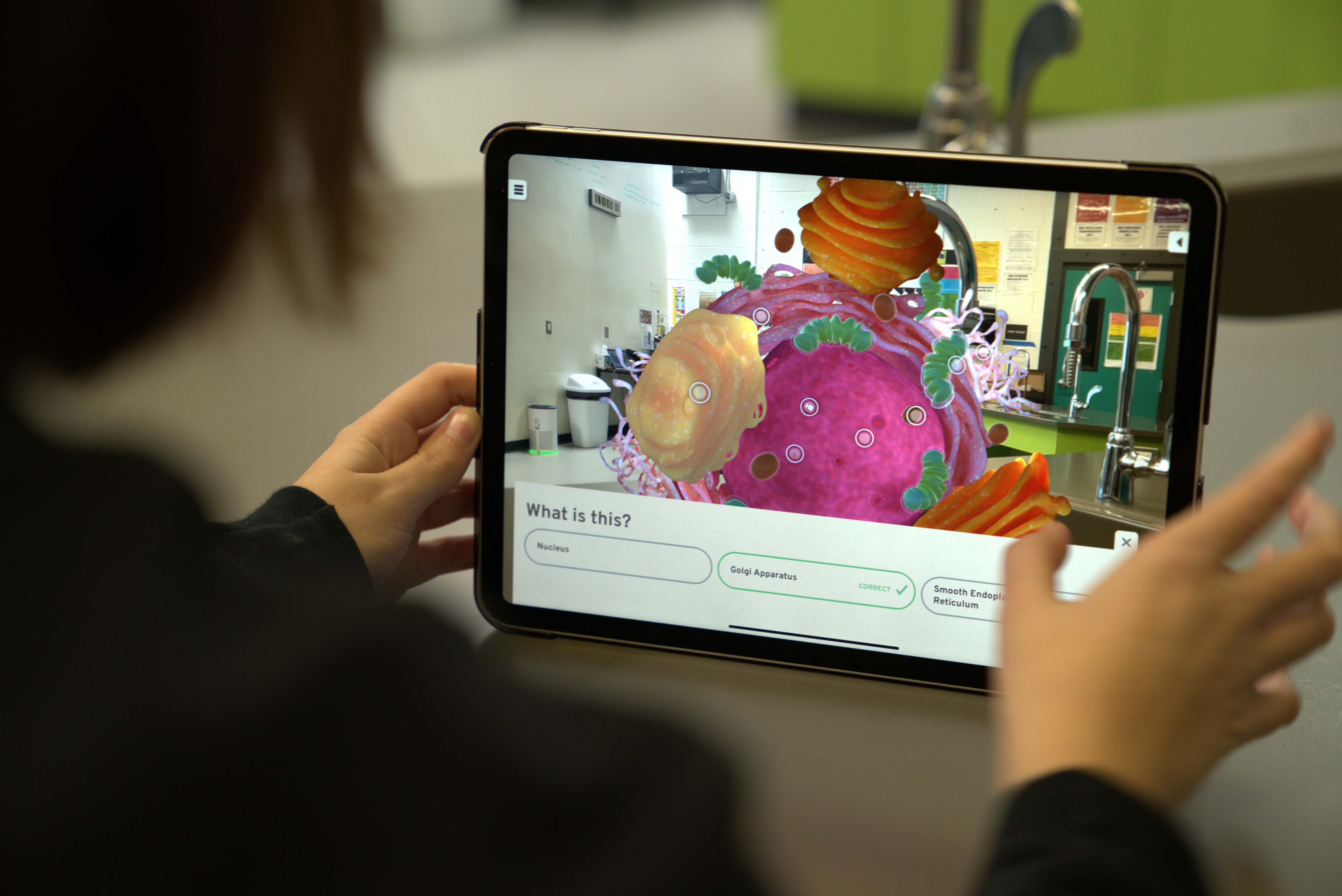 student using tablet with Step into Biology app