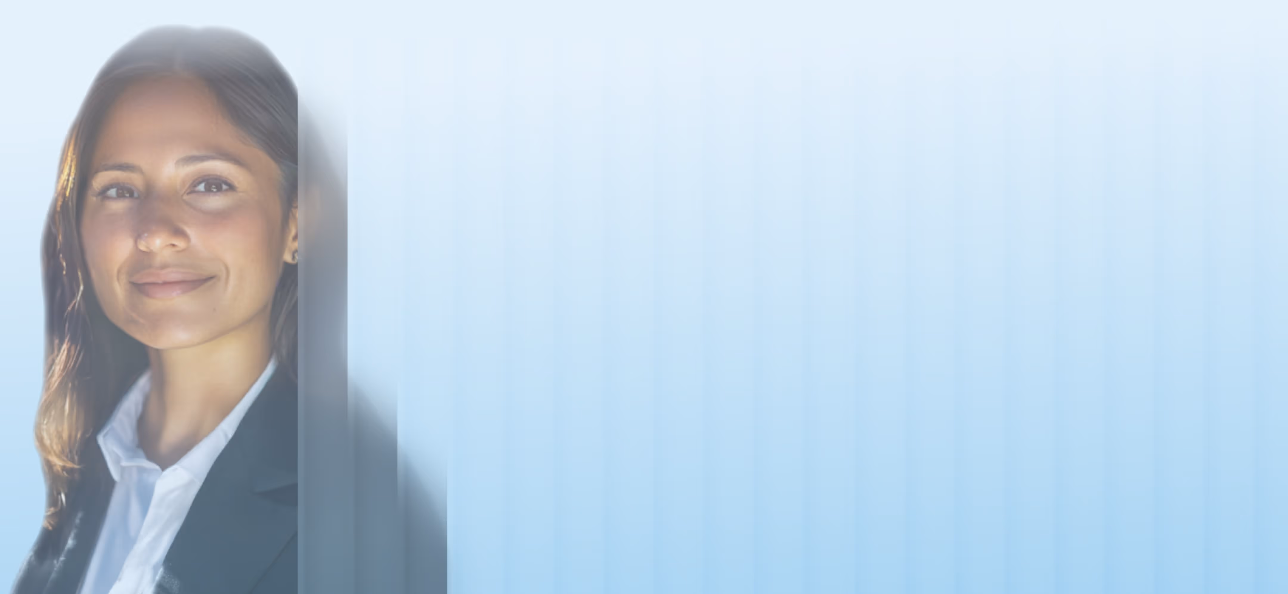 Professional woman in business attire smiling with Zuma background