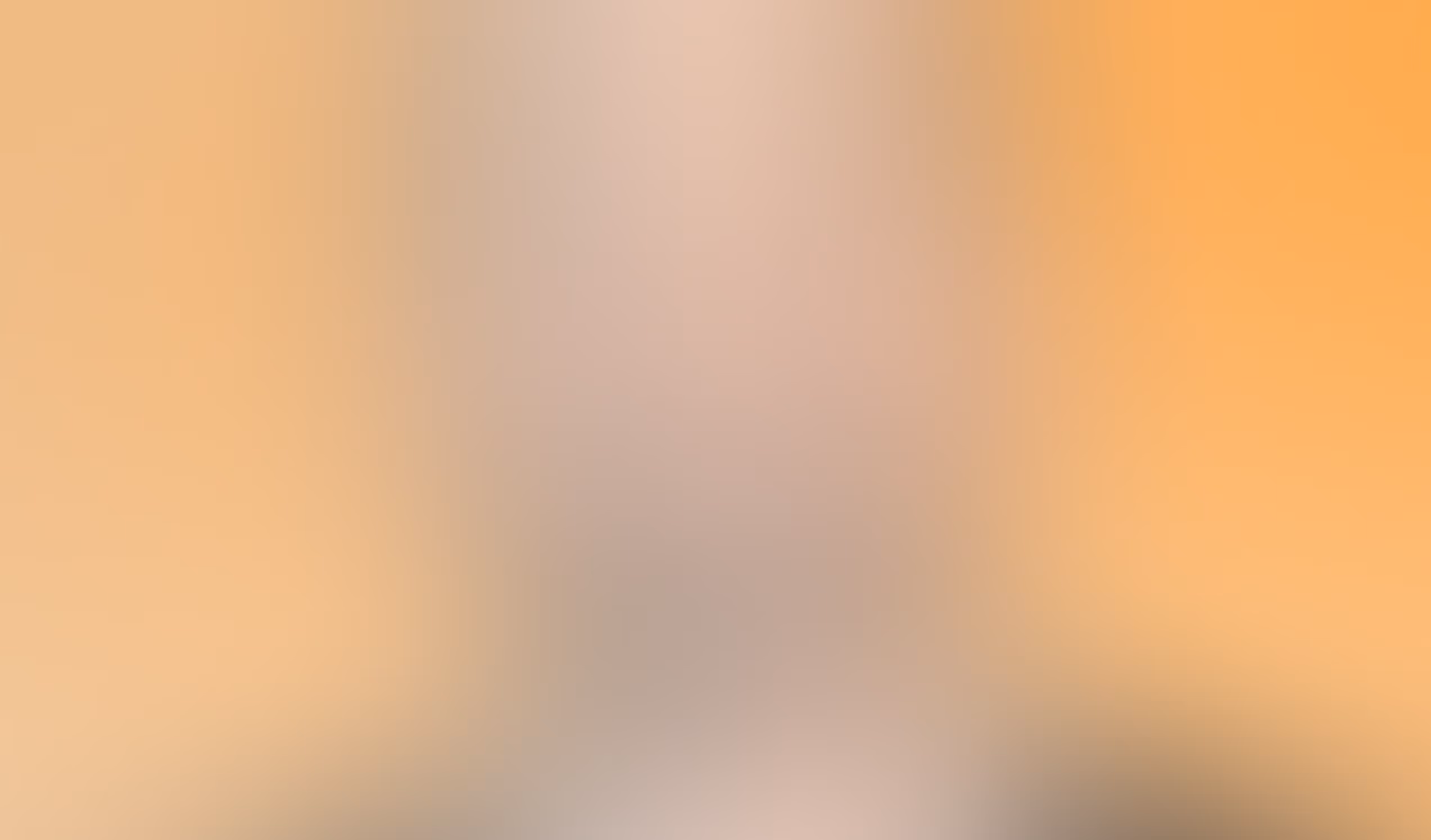 Zuma blurry gradient background with soft orange and beige tones