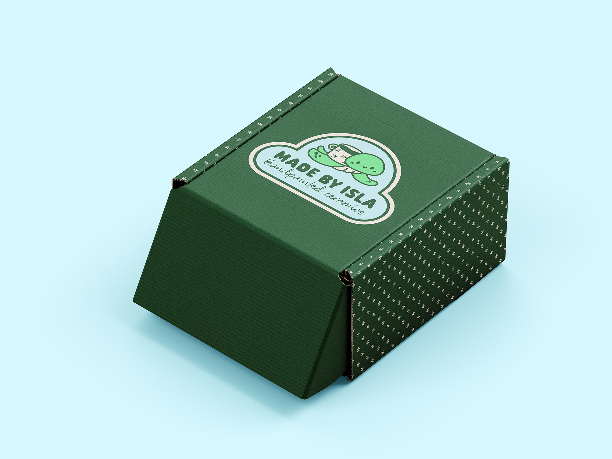 Made by Isla logo on green patterned cardboard box.