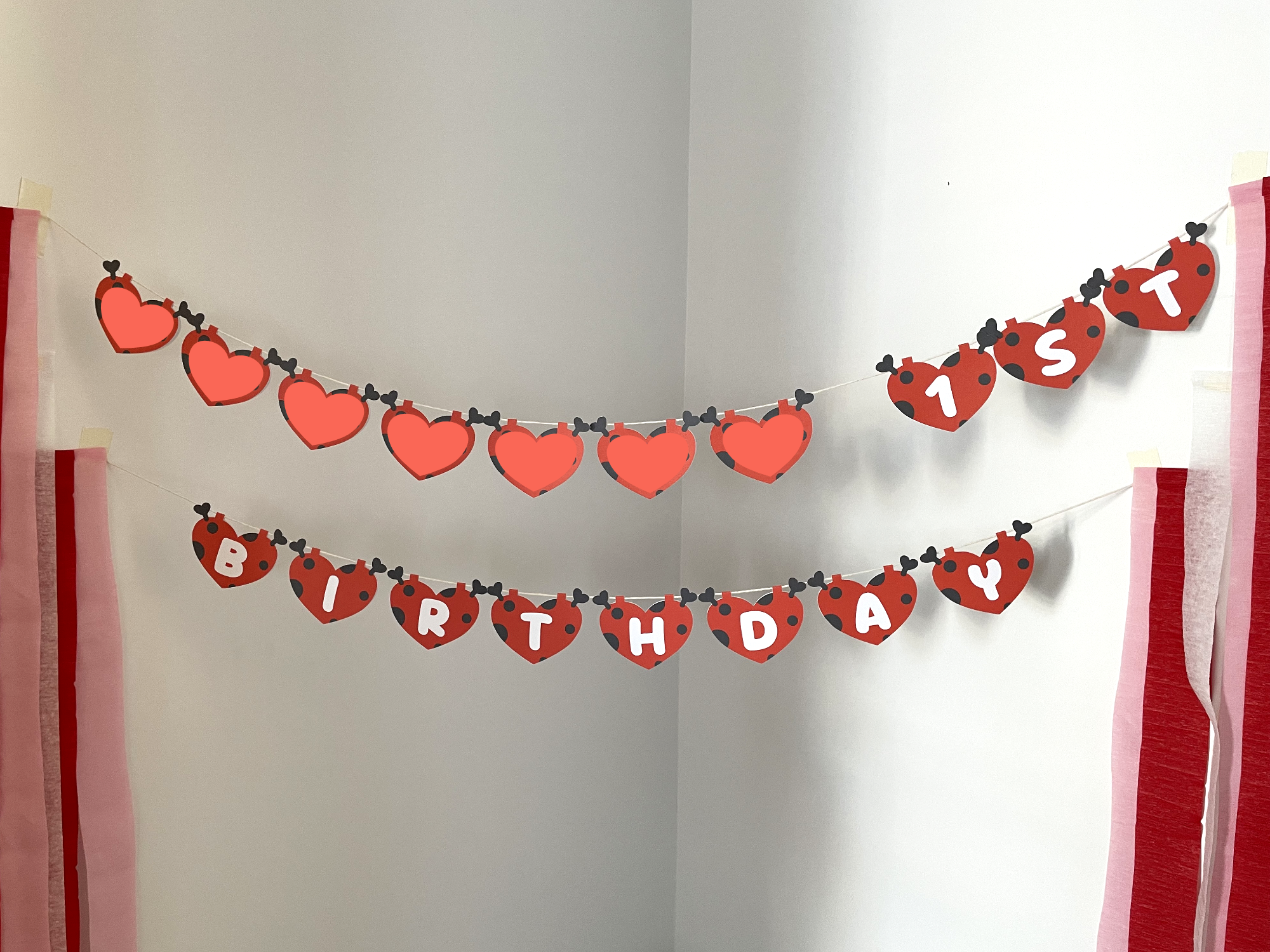 Lovebug-themed heart banner with ____ 1st Birthday