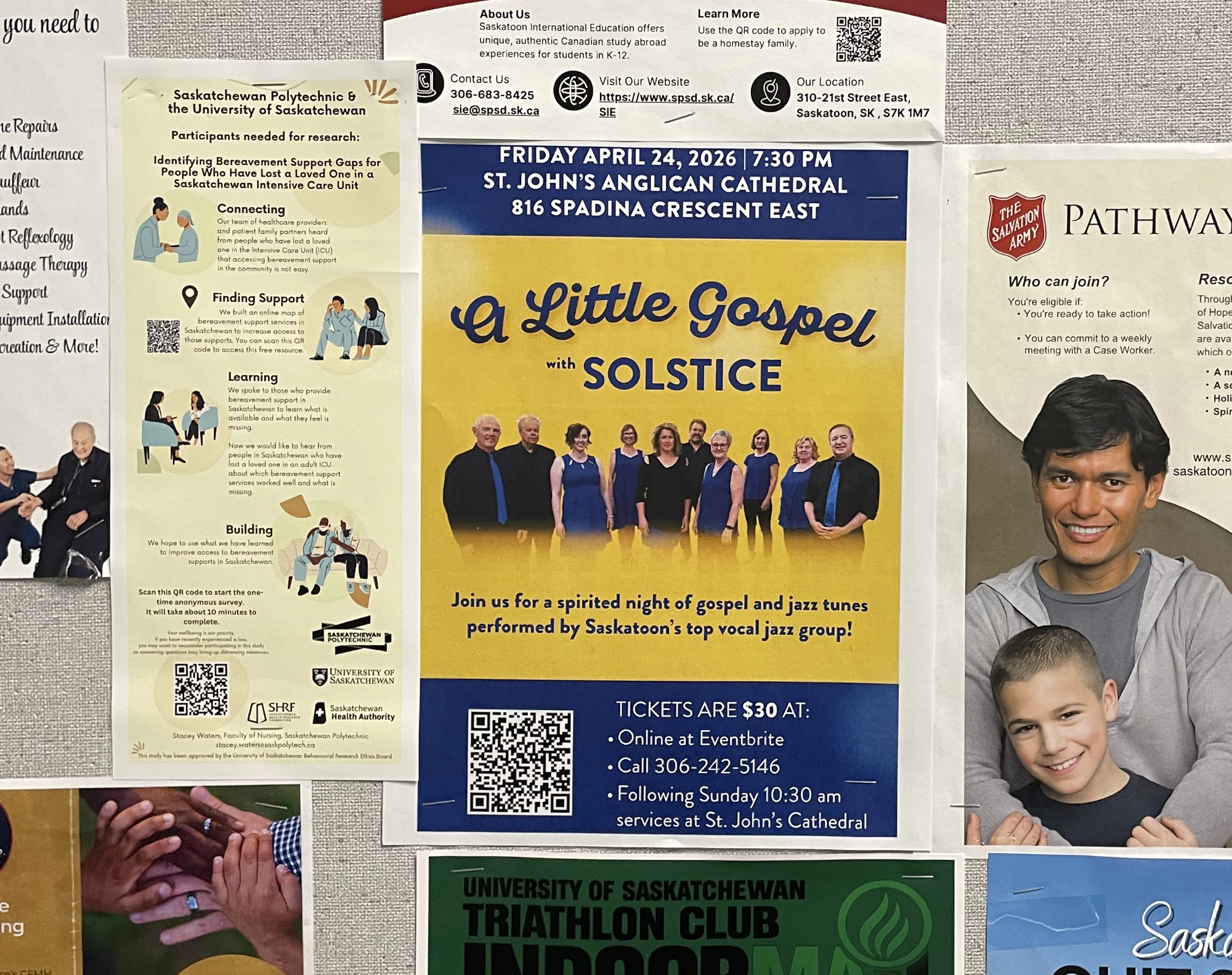 Solstice Gospel Concert poster on bulletin board with other posters