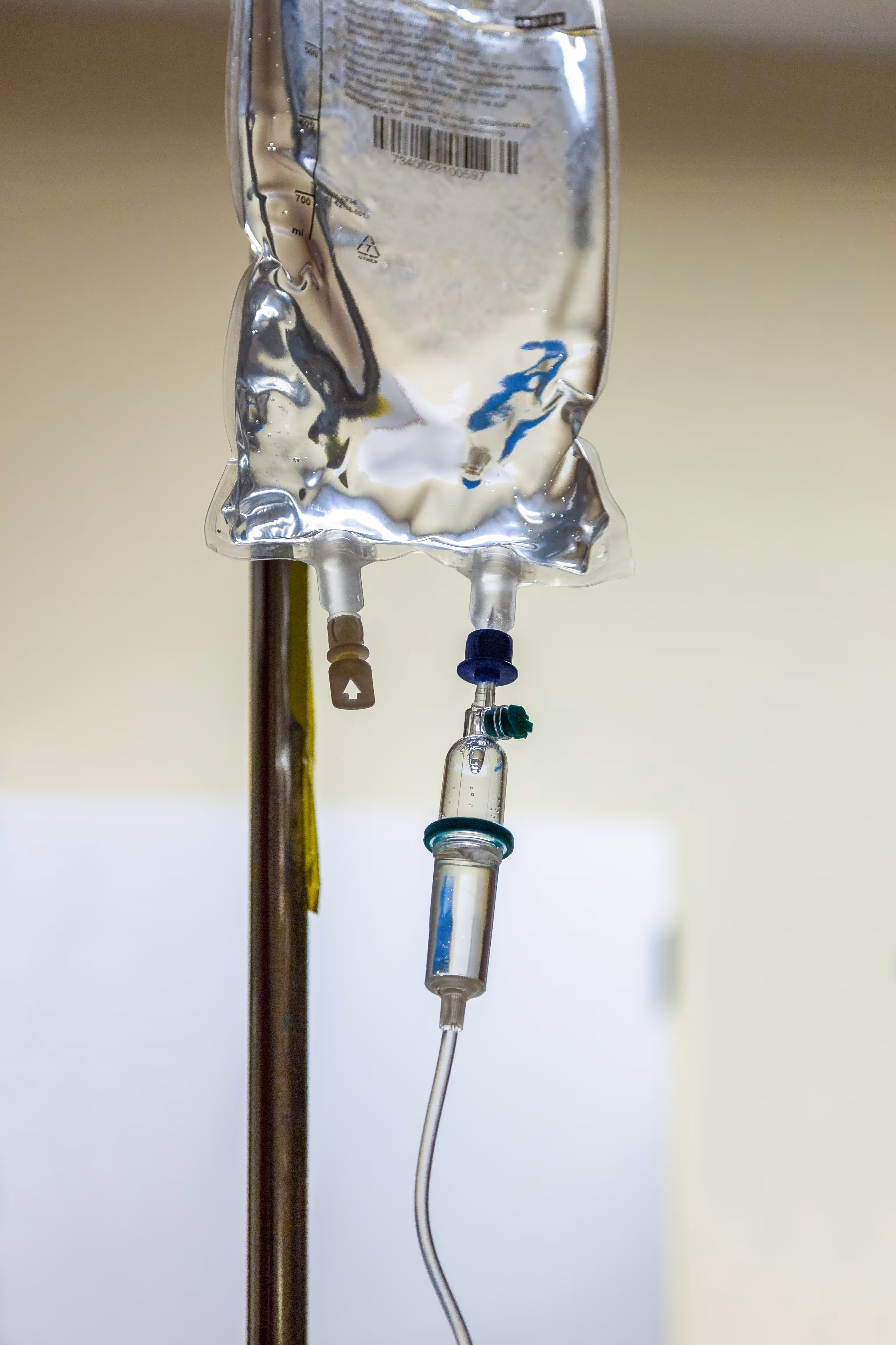 A medical device attached to a metal pole.