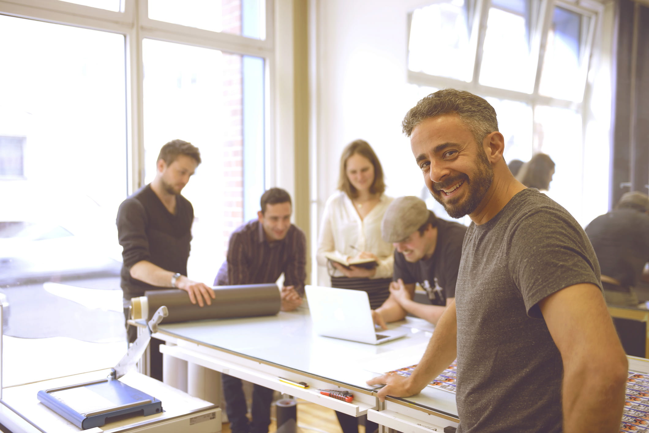 Small business owner working with his team