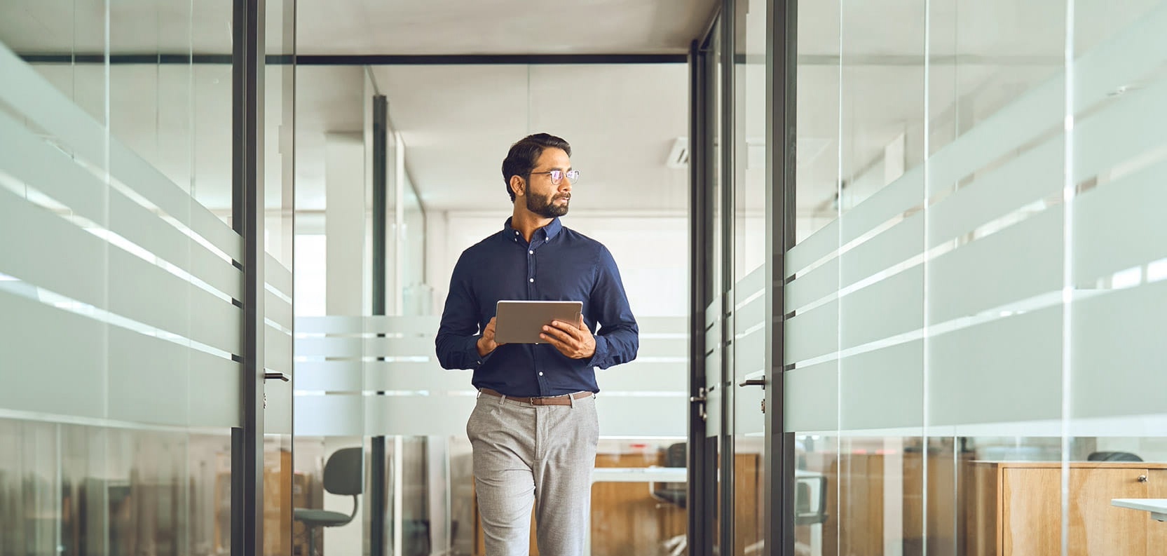 Business professional posing in a modern office space
