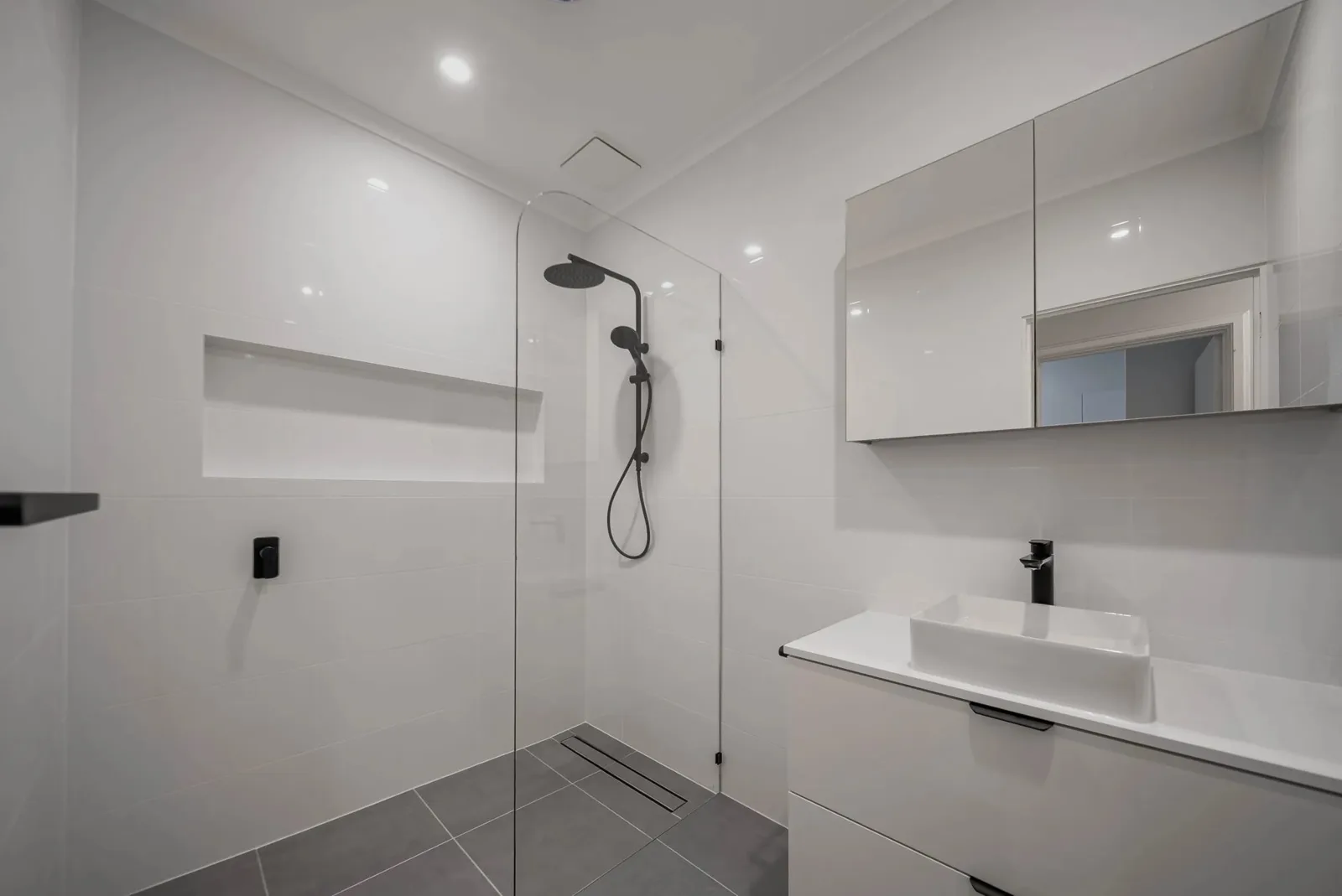 White vanity, mirror cabinet and frameless shower screen, Gault Rd, Belair