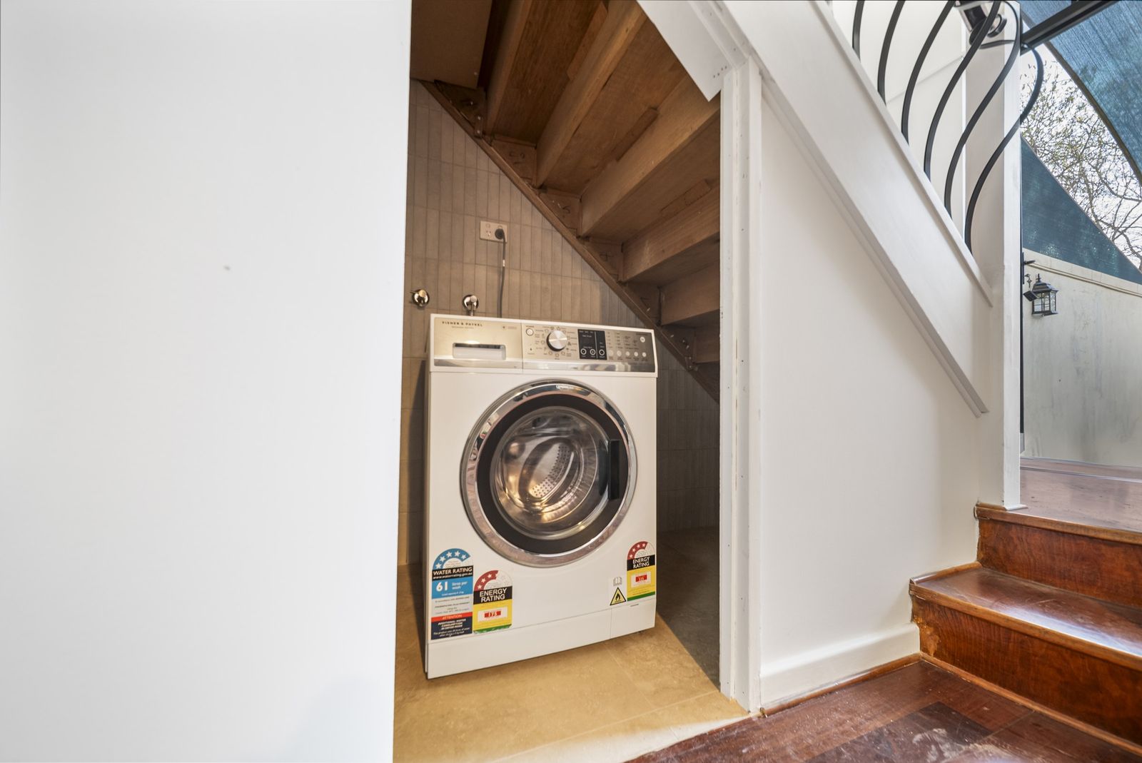 Washing machine integrated under the timber staircase, Angas St, Adelaide