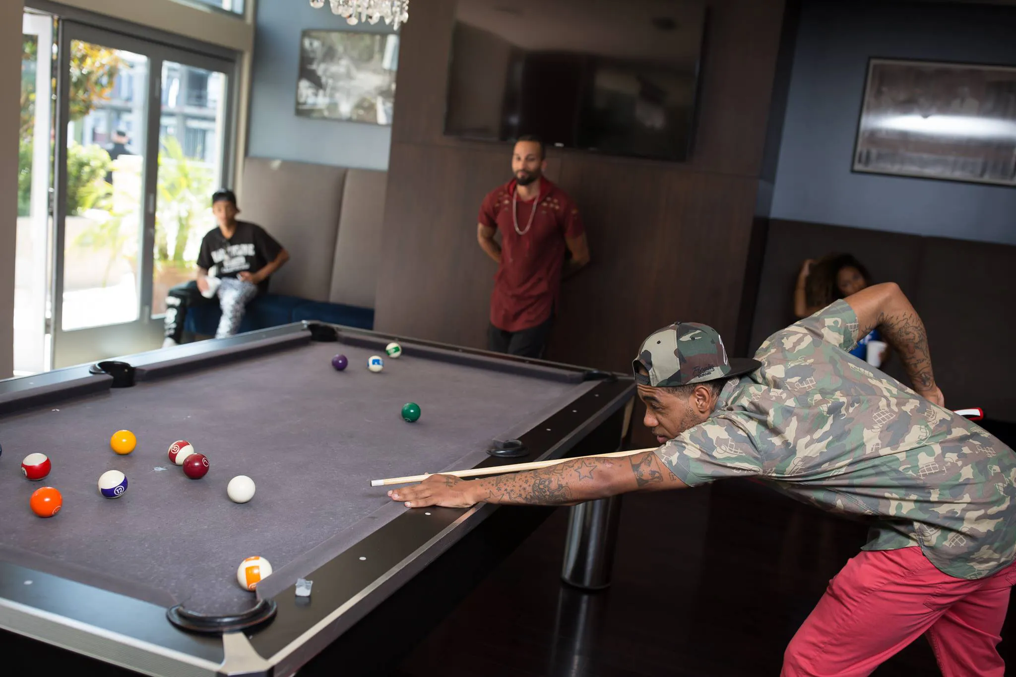 Group of people playing billiards