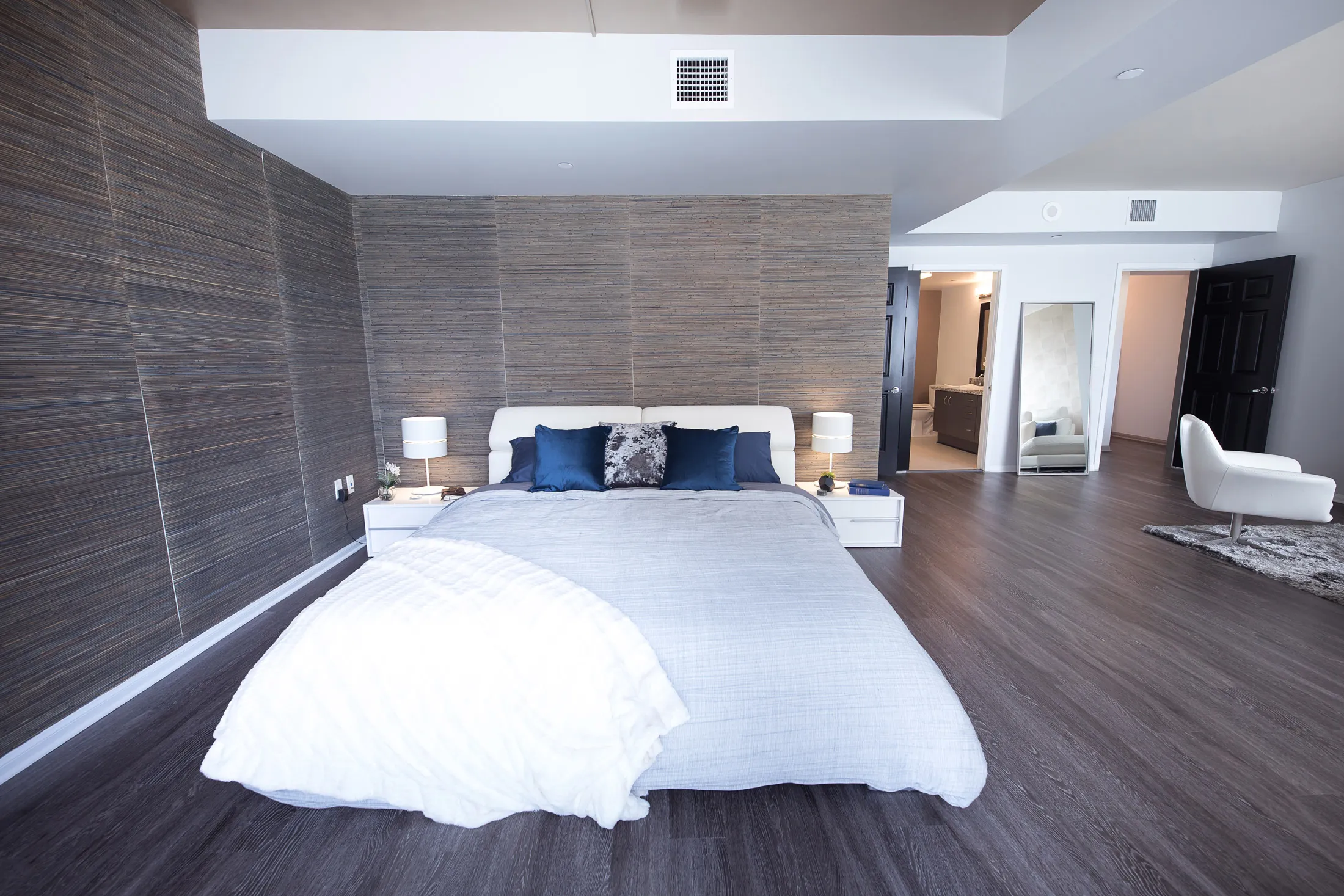 Grey bed placed within interior cutout.