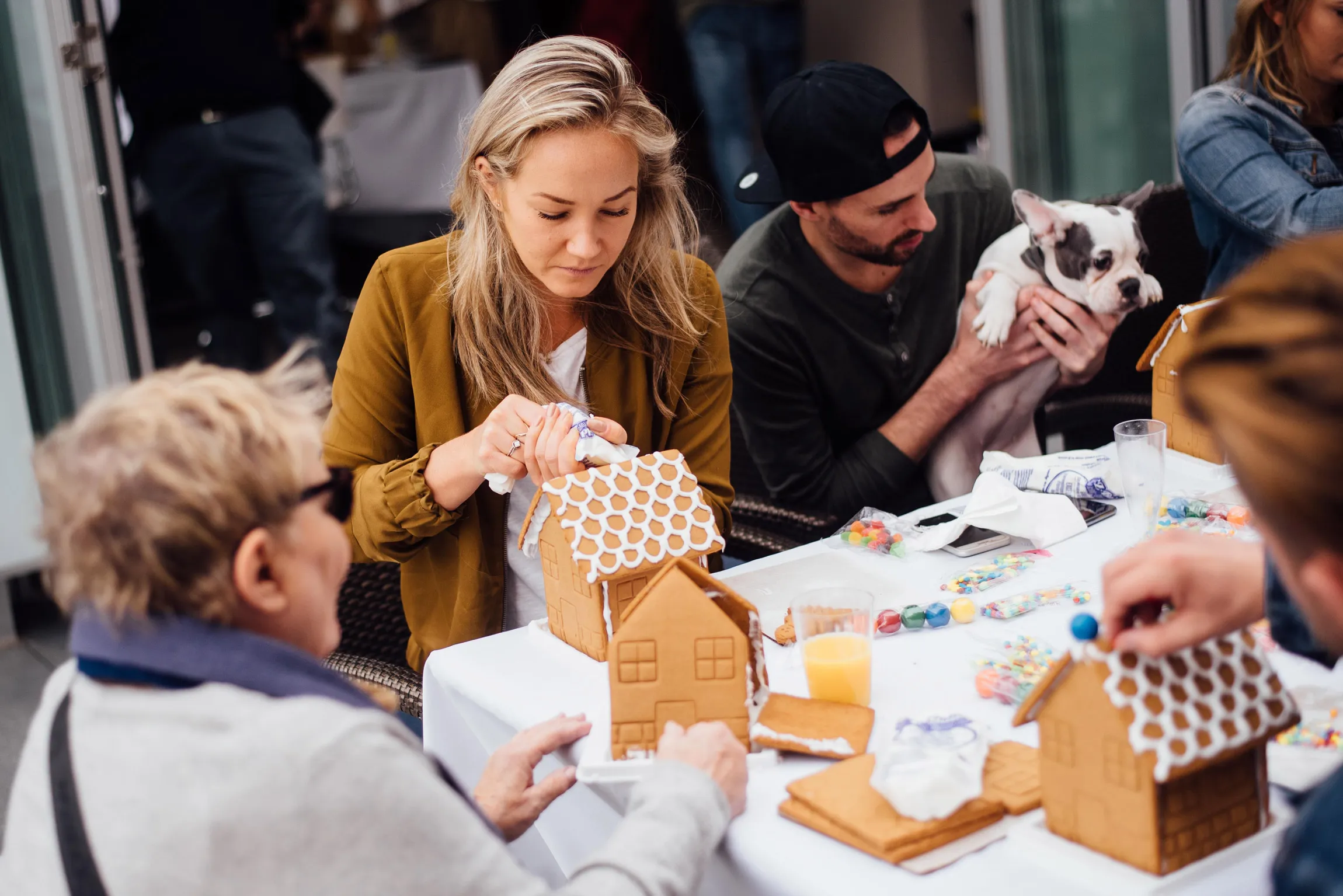 People building gingerbread houses