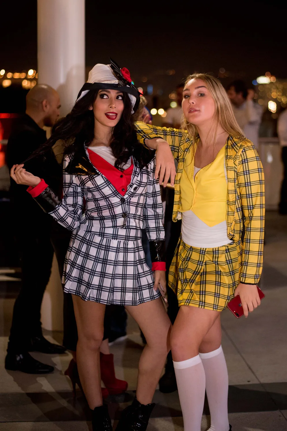 Nighttime event, 2 women dressed up