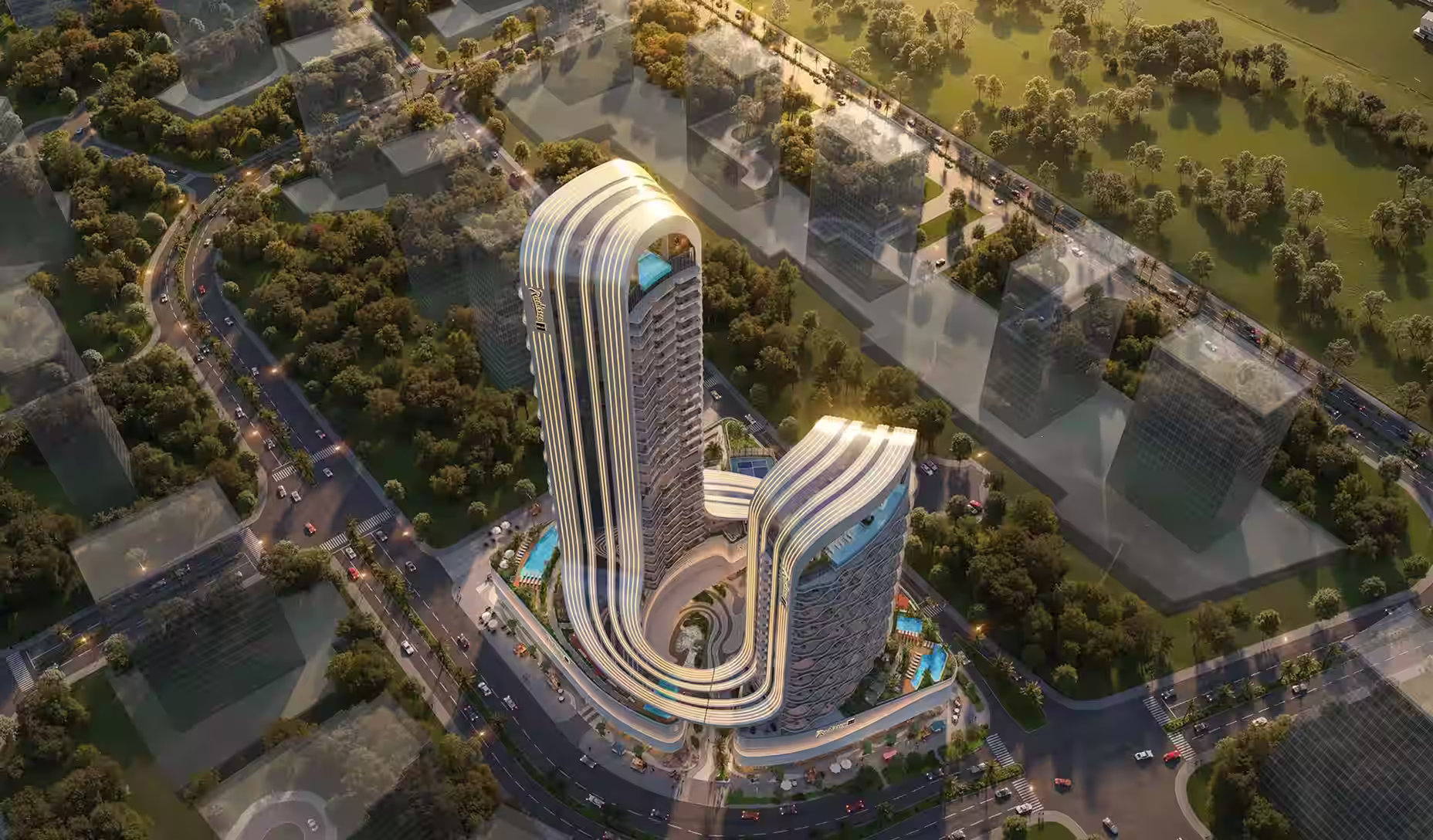 Aerial view of a modern, curved twin-tower building complex with rooftop pools, surrounded by roads and green trees.