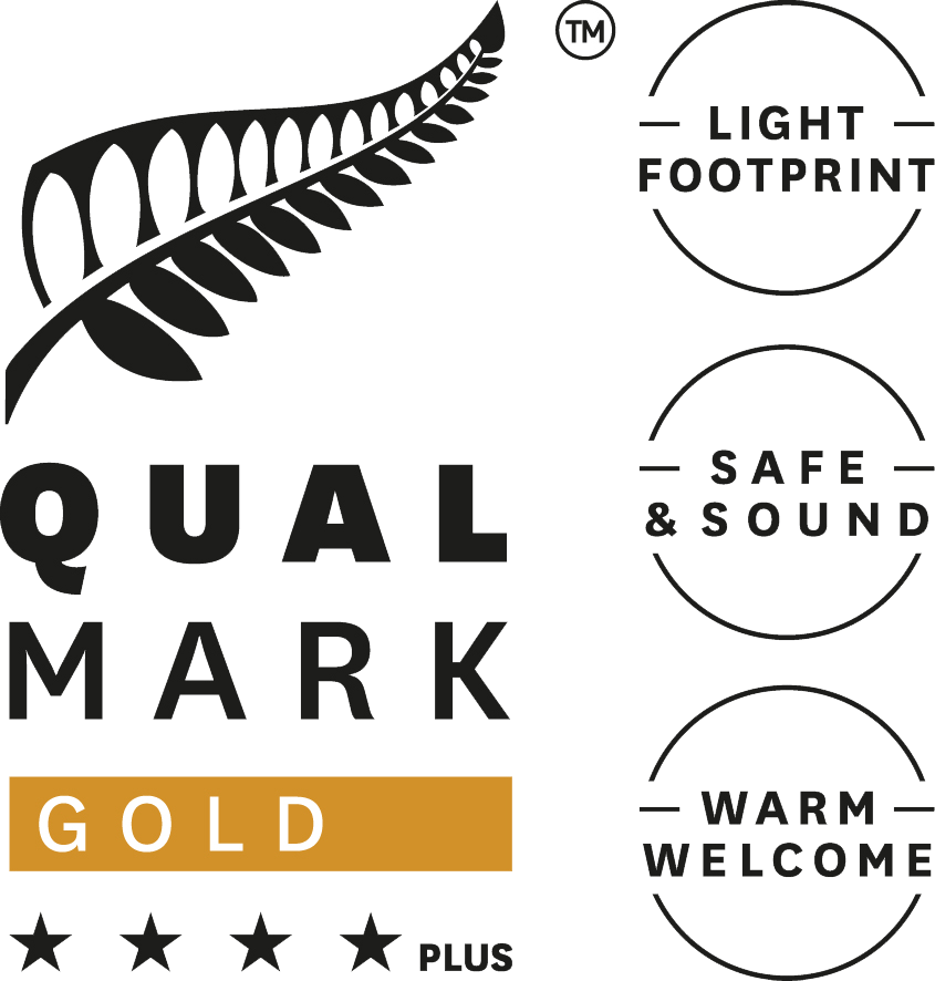 Qualmark Silver Sustainable Tourism Business Award logo featuring a silver fern and text 'Light Footprint', 'Safe & Sound', and 'Warm Welcome'.