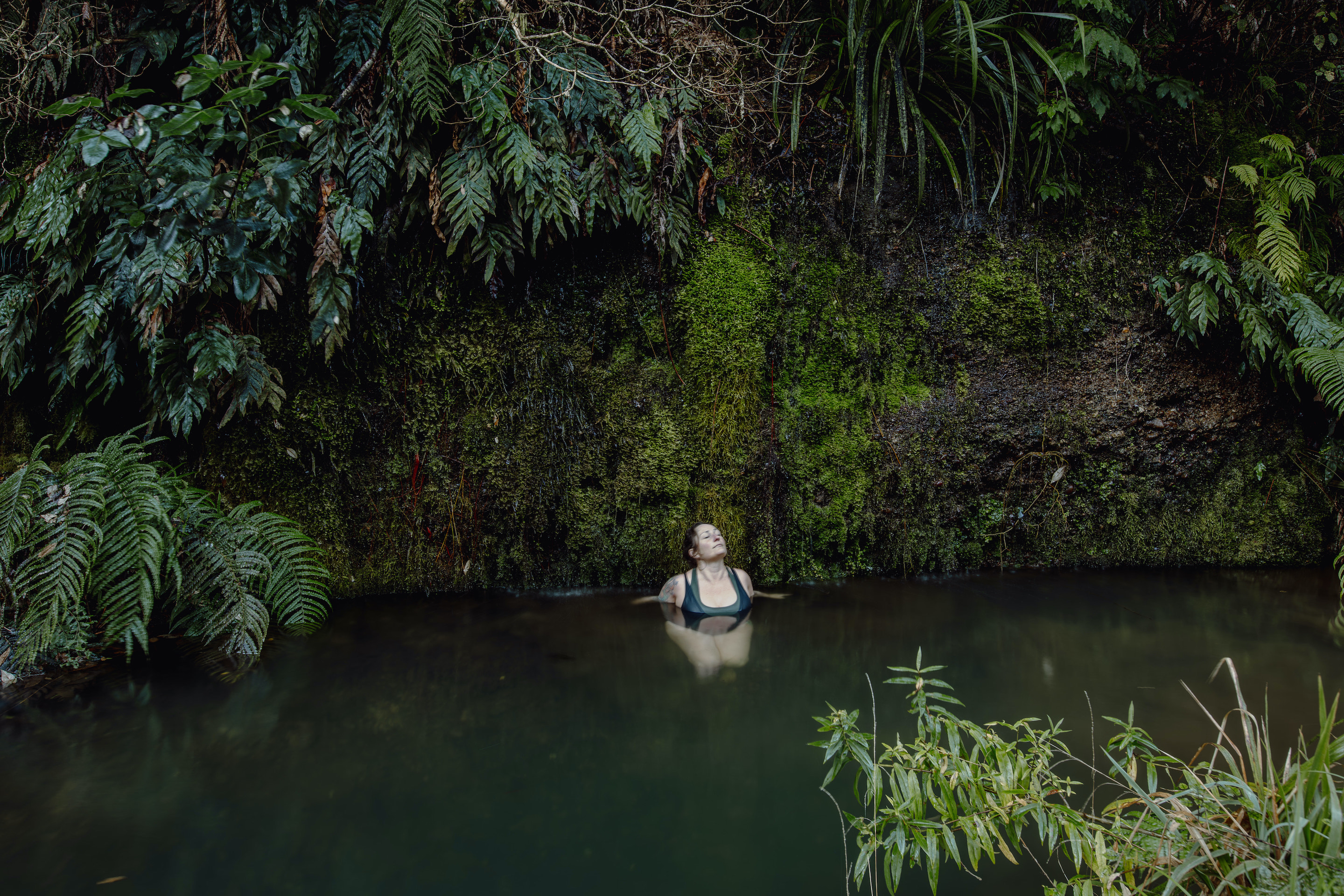 Woman swimming in the forest
