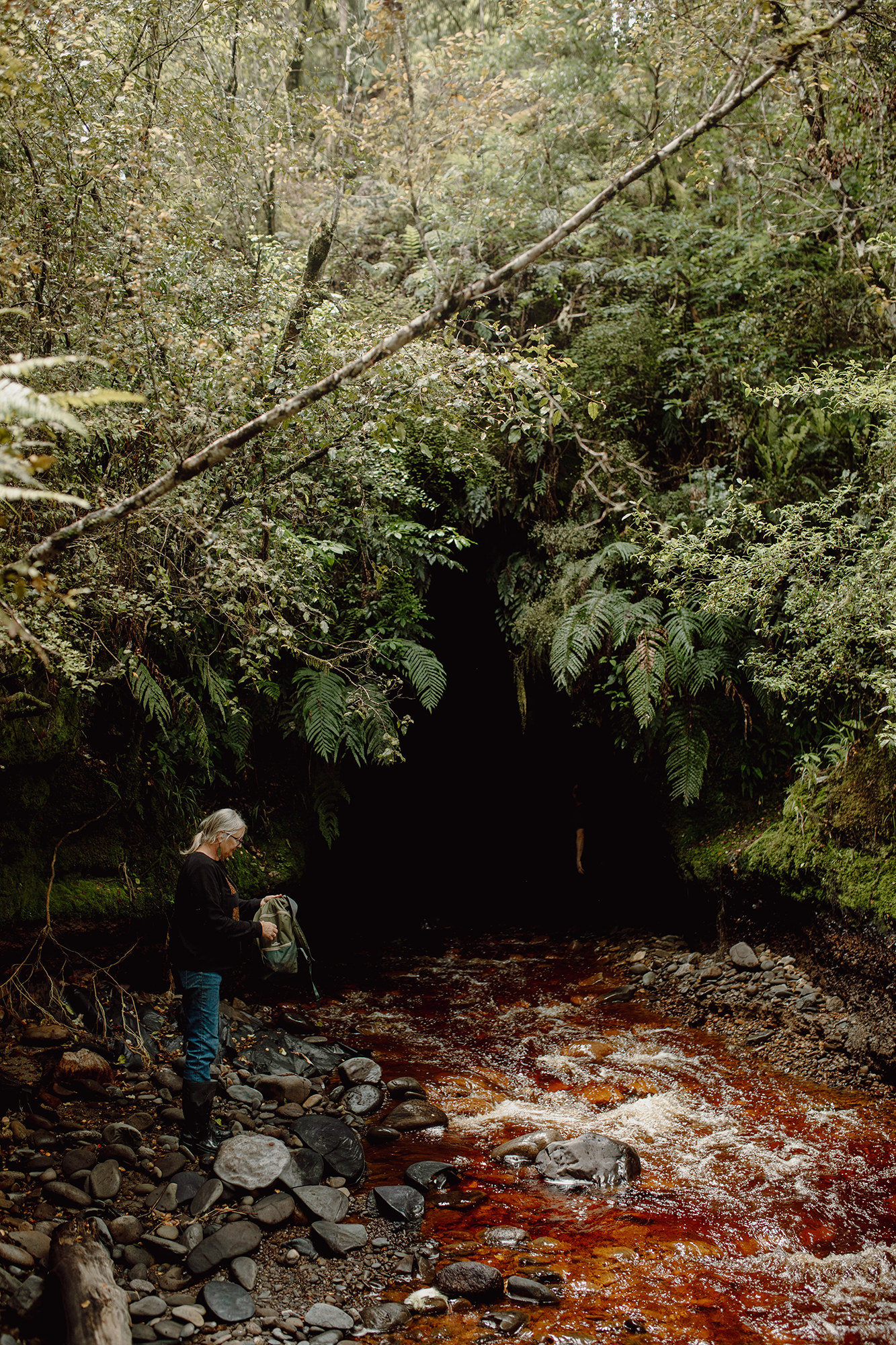 woman going into glow worm tunnel