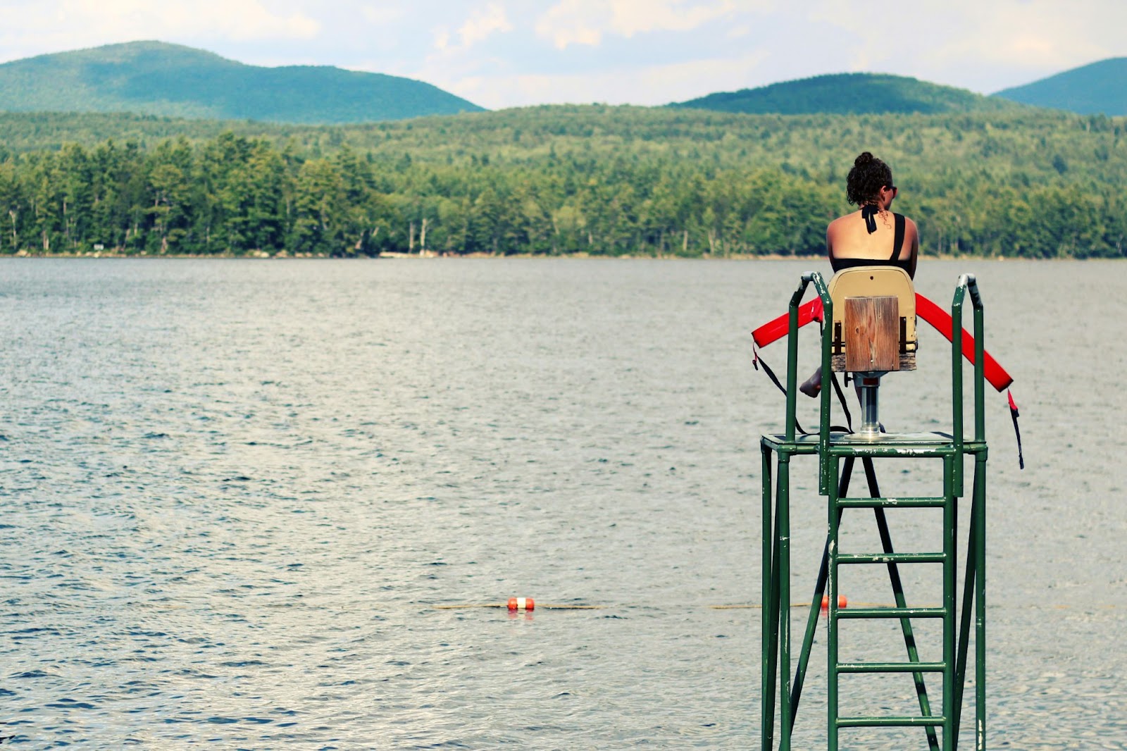 A lifeguard on duty overlooking a lake.