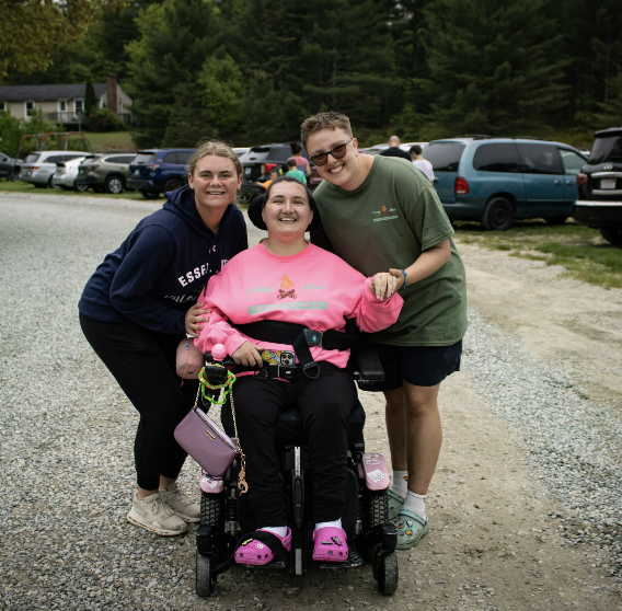 Camp Allen participants posing for a photo in a parking lot