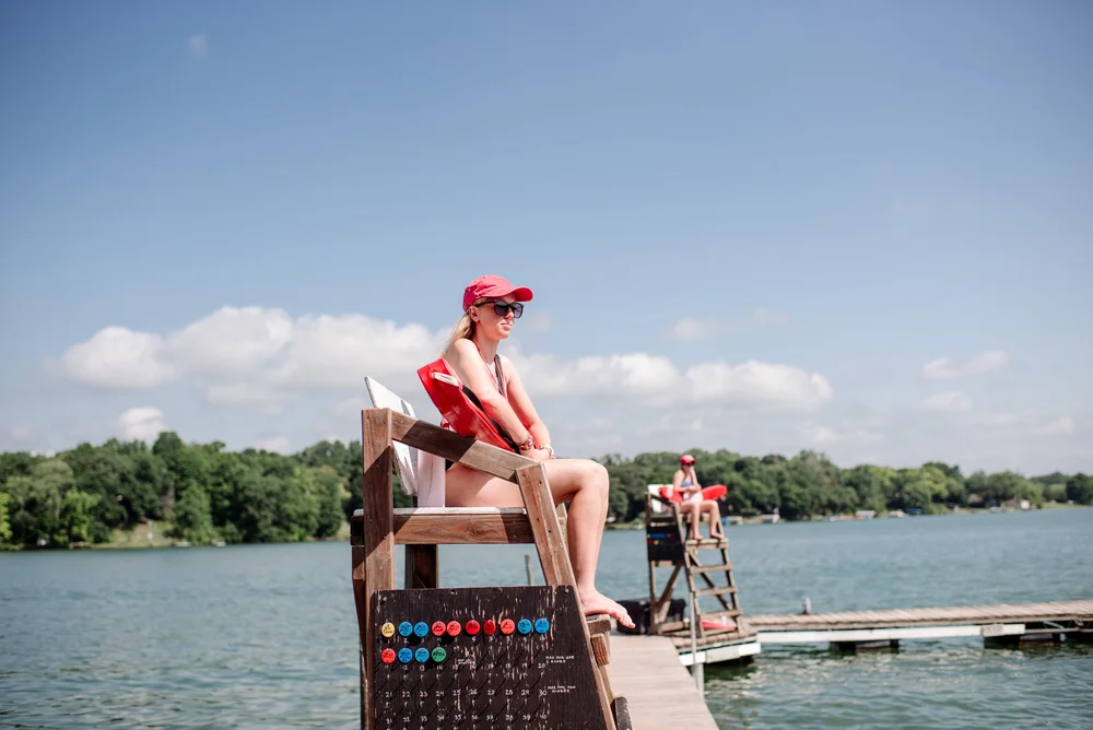 Lifeguard camp counsellors at Phantom Lake YMCA Cam watch over the lake from towers