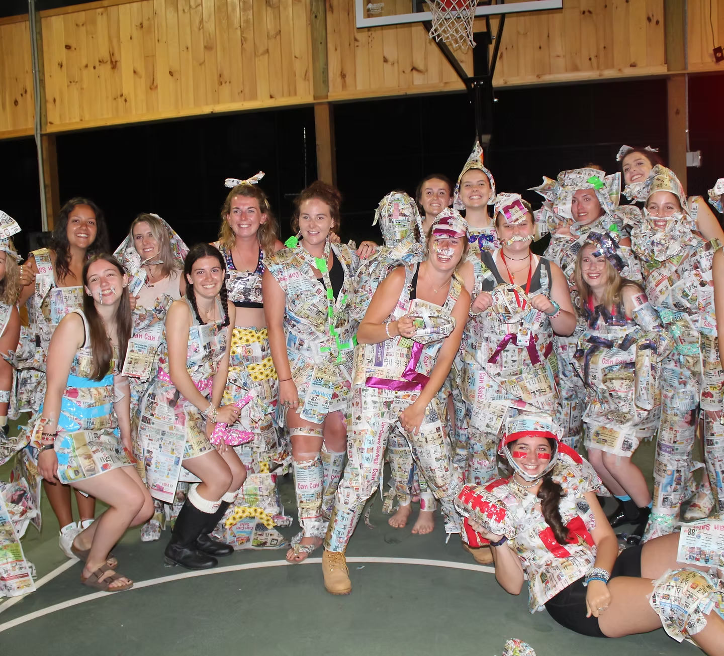 Camp counsellors at Camp Chipinaw dressed in newspaper for a game