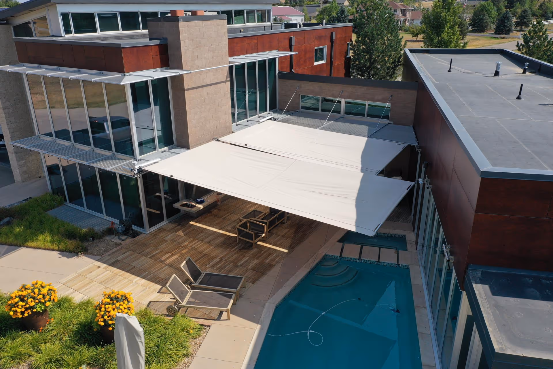 An aerial photograph showing the two rectangular sails and the new space that is being created and protected in the outdoor area.