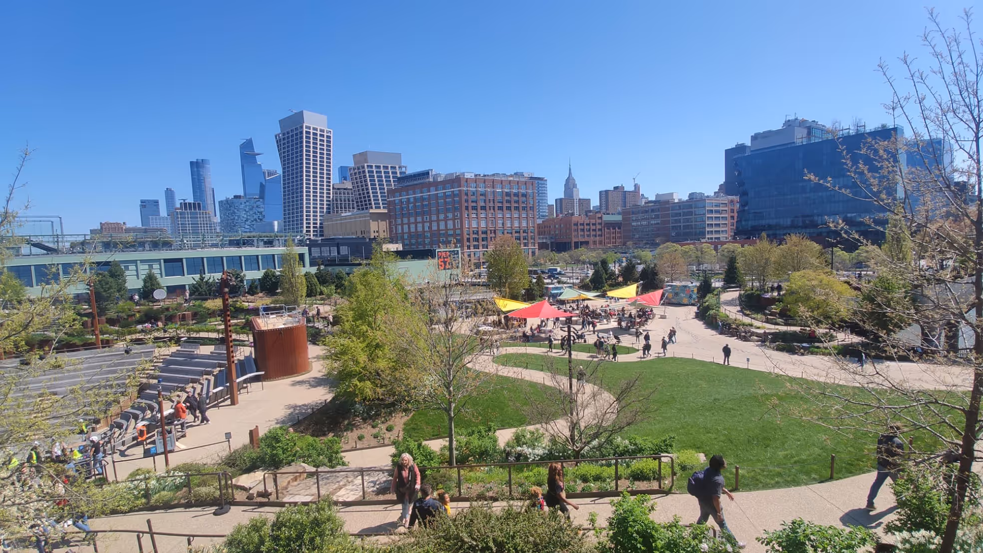 A view from the distance to the sail umbrellas of SunSquare installed at Little Island Park in New York.