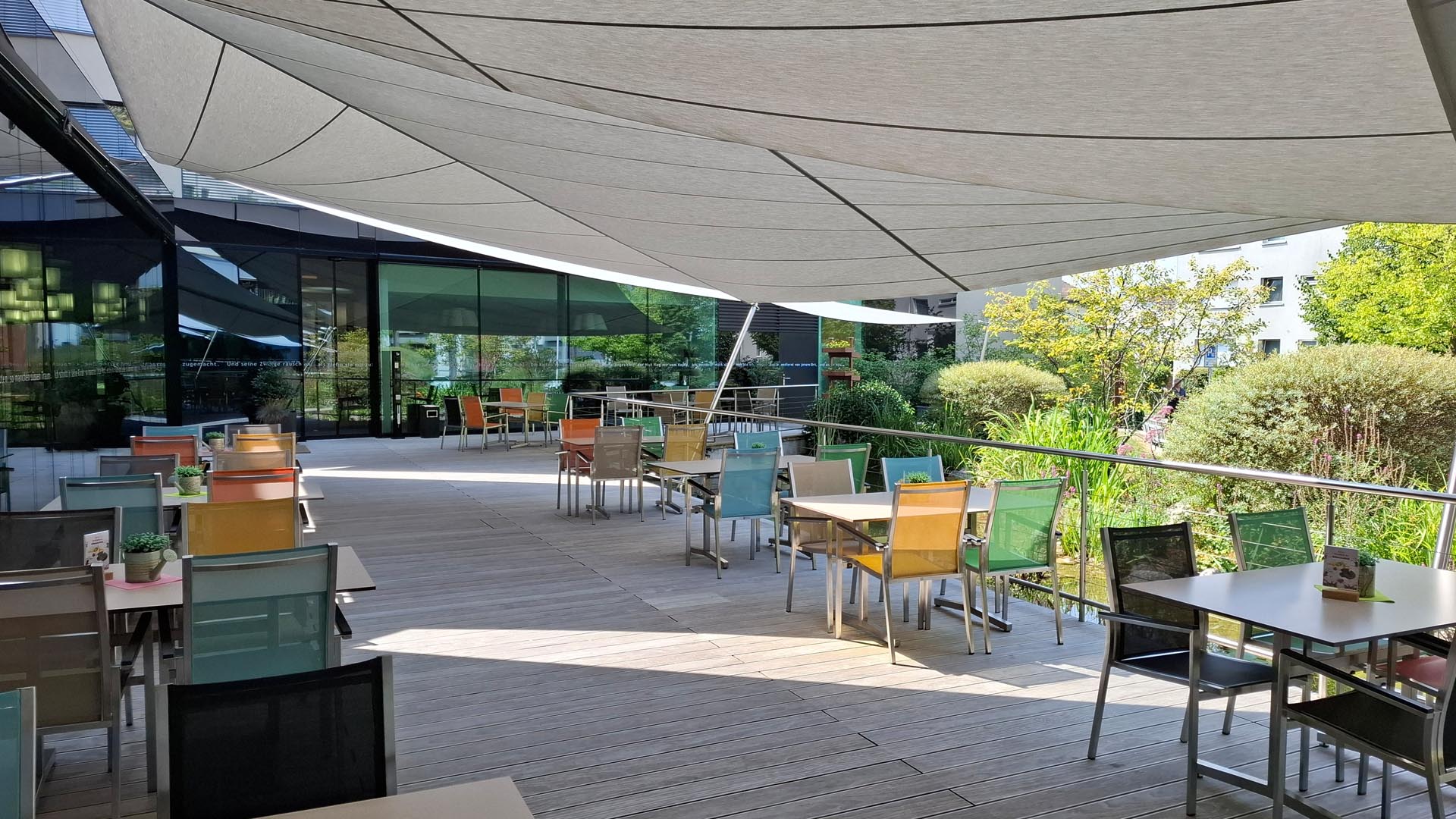 Dreilinden furniture: Large-scale SunSquare sun protection for terrace & glass front controllable via handheld transmitter for outdoor comfort.
