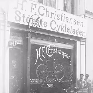 A black and white picture of an old storefront of HF. Christiansen.