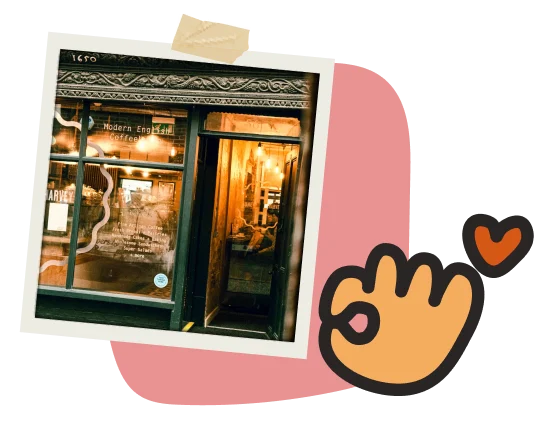 Cozy, warmly lit coffee shop with vintage decor and "Modern English Coffee" written on the window. Surrounded by playful design elements like a heart and hand gesture icon. Inviting, boutique café vibe.