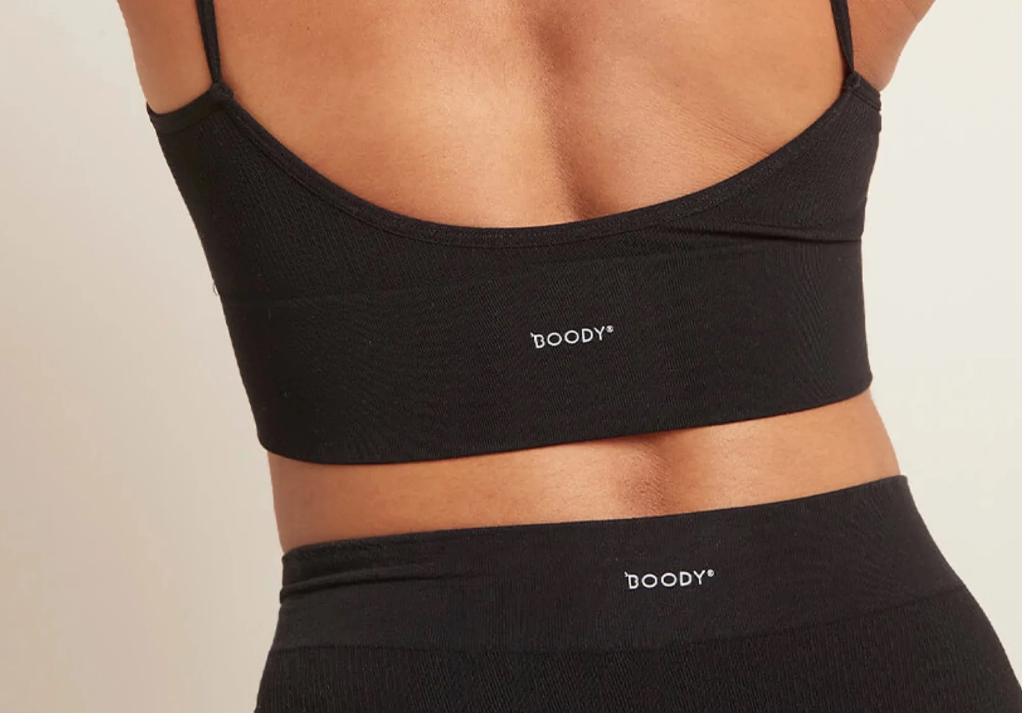 Close-up of a model wearing black Boody activewear, used as a temporary sample thumbnail for the Case Study template