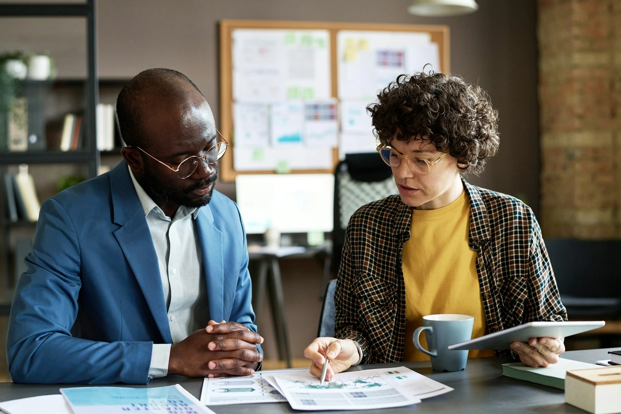 A business leader guiding a team toward a shared strategic vision