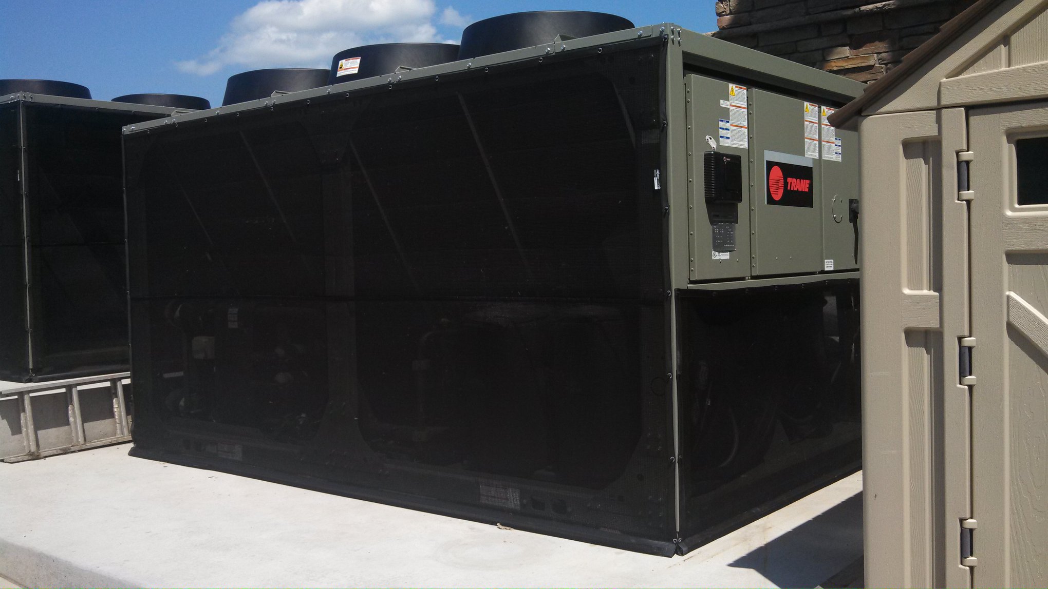 Large commercial complex rooftop HVAC system with integrated PCO cells for air purification