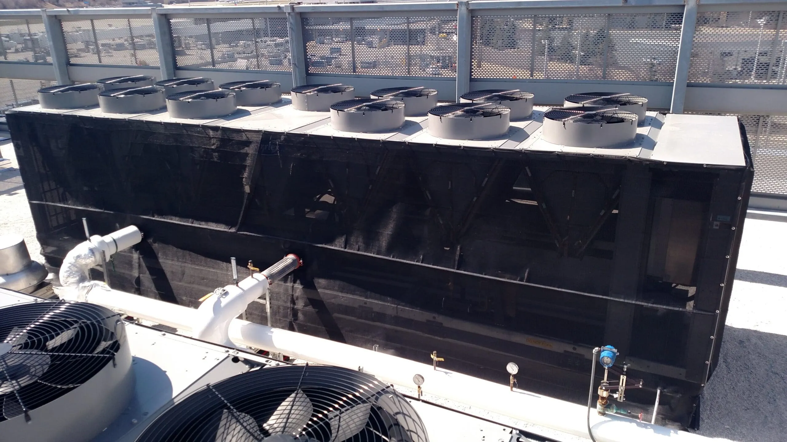 Large industrial chiller installation at airport showing high-capacity commercial HVAC system for critical infrastructure applications