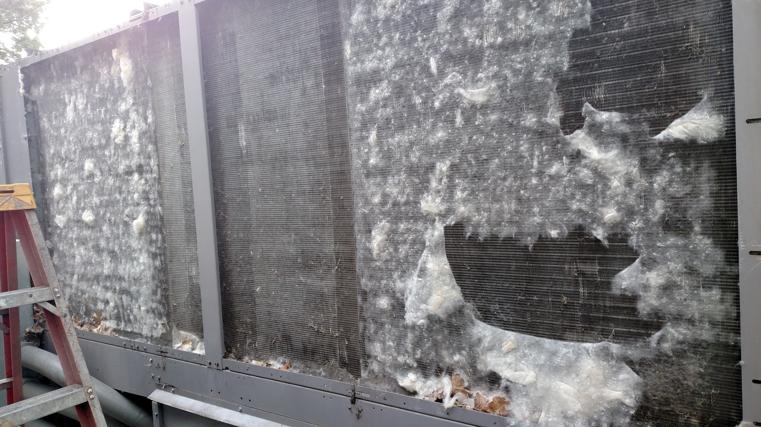 Professional fin combing process using specialized tools to repair coil damage