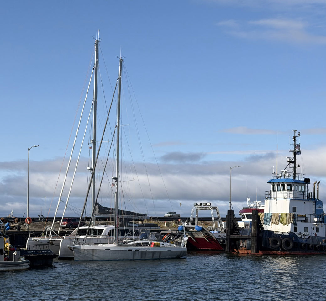 Vanuily and Hafiz rafted together in Nome, Alaska, with their crews celebrating over champagne