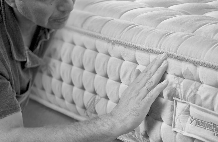 Italian craftsman handmaking a mattress