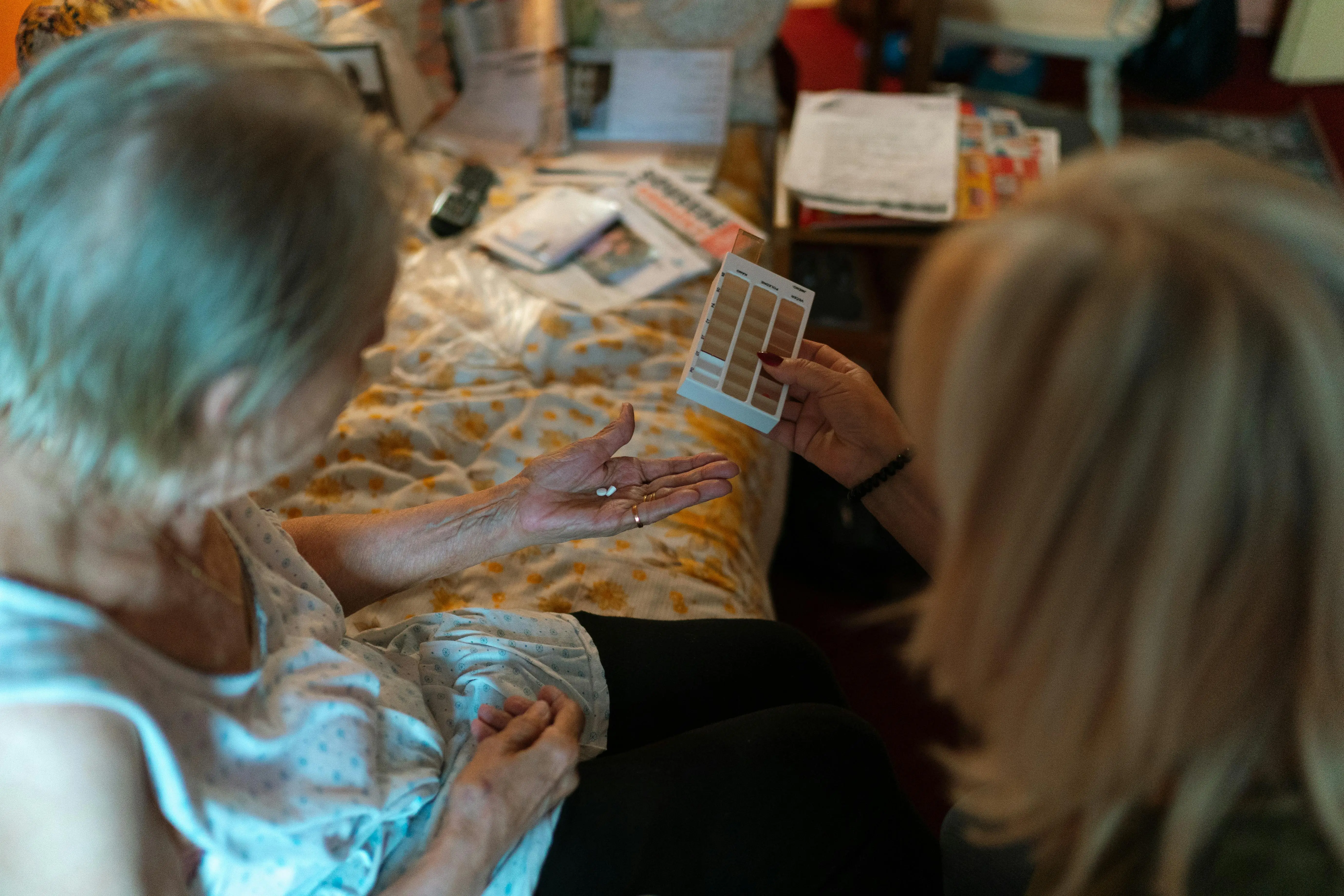 A key part of specialized nursing care: a caregiver providing precise medication management for a client at home.