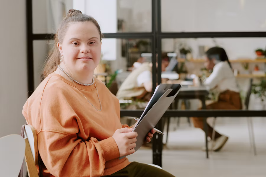 disabled young girl sitting down and reading