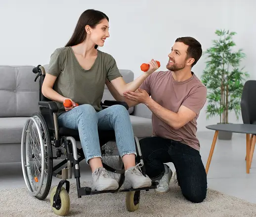 instructor pushing disabled woman on wheelchair