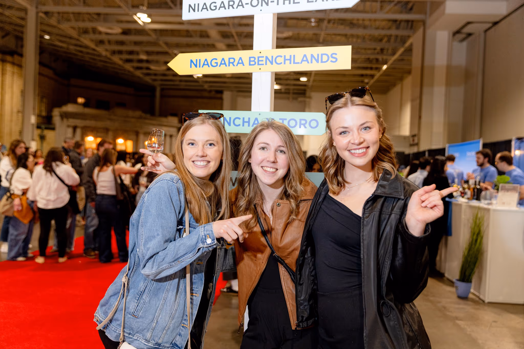 Three women smiling at the camera