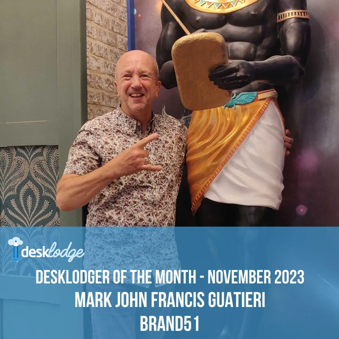 Mark of Brand51 stood with his arm around an Egyptian pharoah statue at DeskLodge Beacon Tower