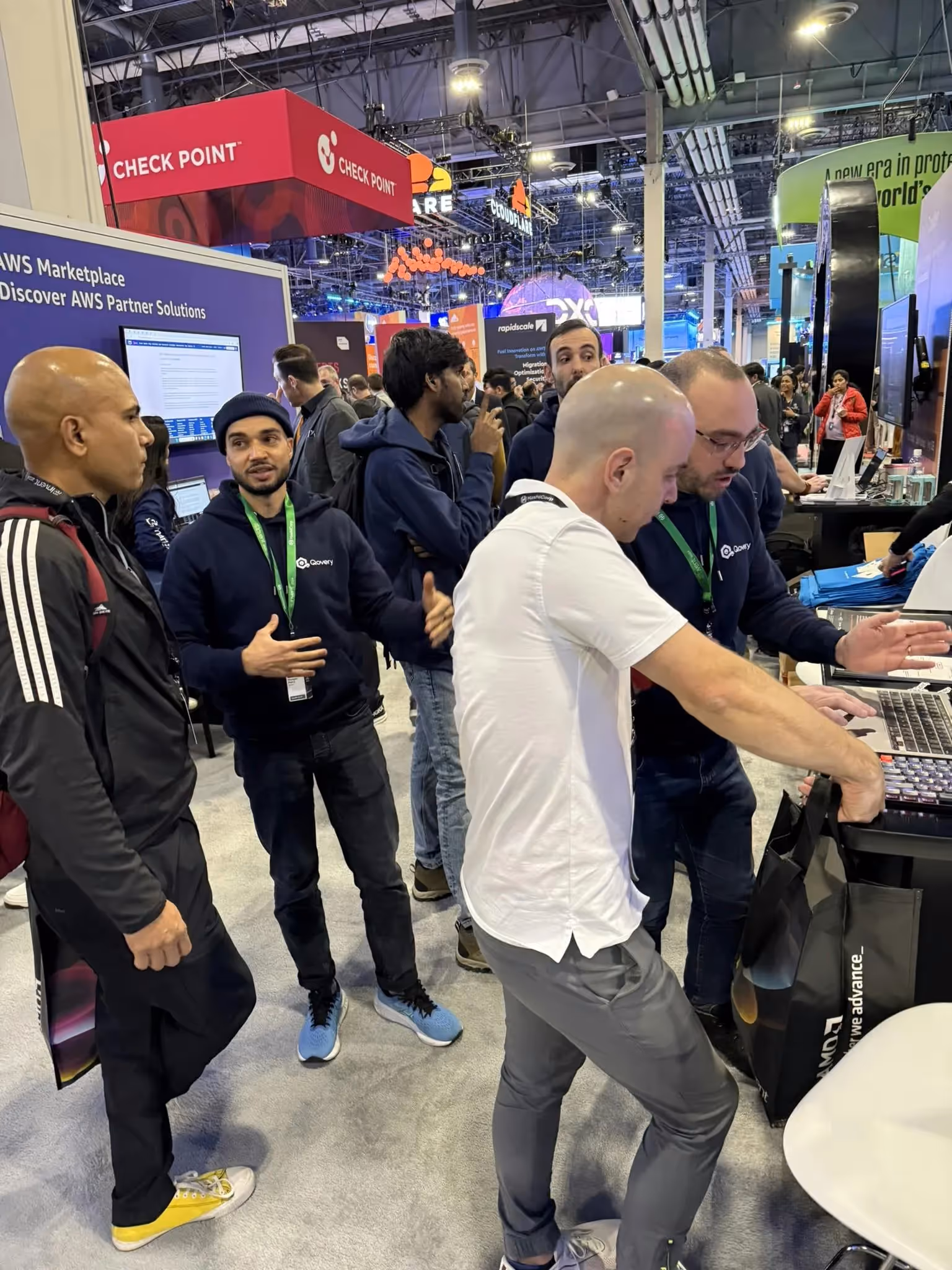 Alessandro, Morgan, and Pierre talking/doing product demo to people at re:Invent 2024