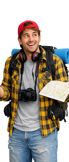 Young man in a red cap and yellow plaid shirt holding a map, with backpack, headphones, and camera around his neck.