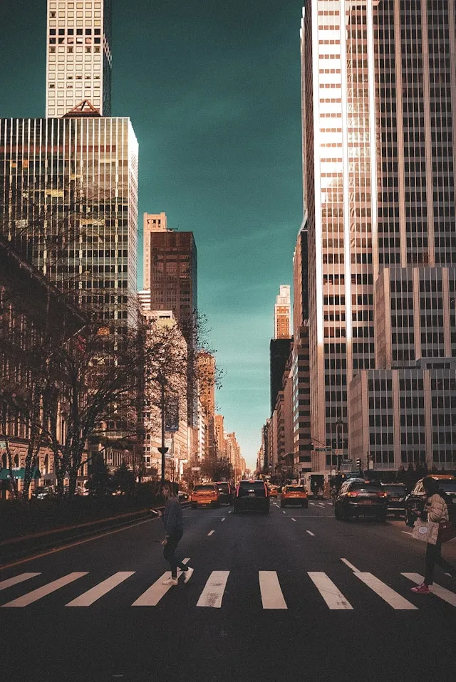 A city street filled with lots of tall buildings