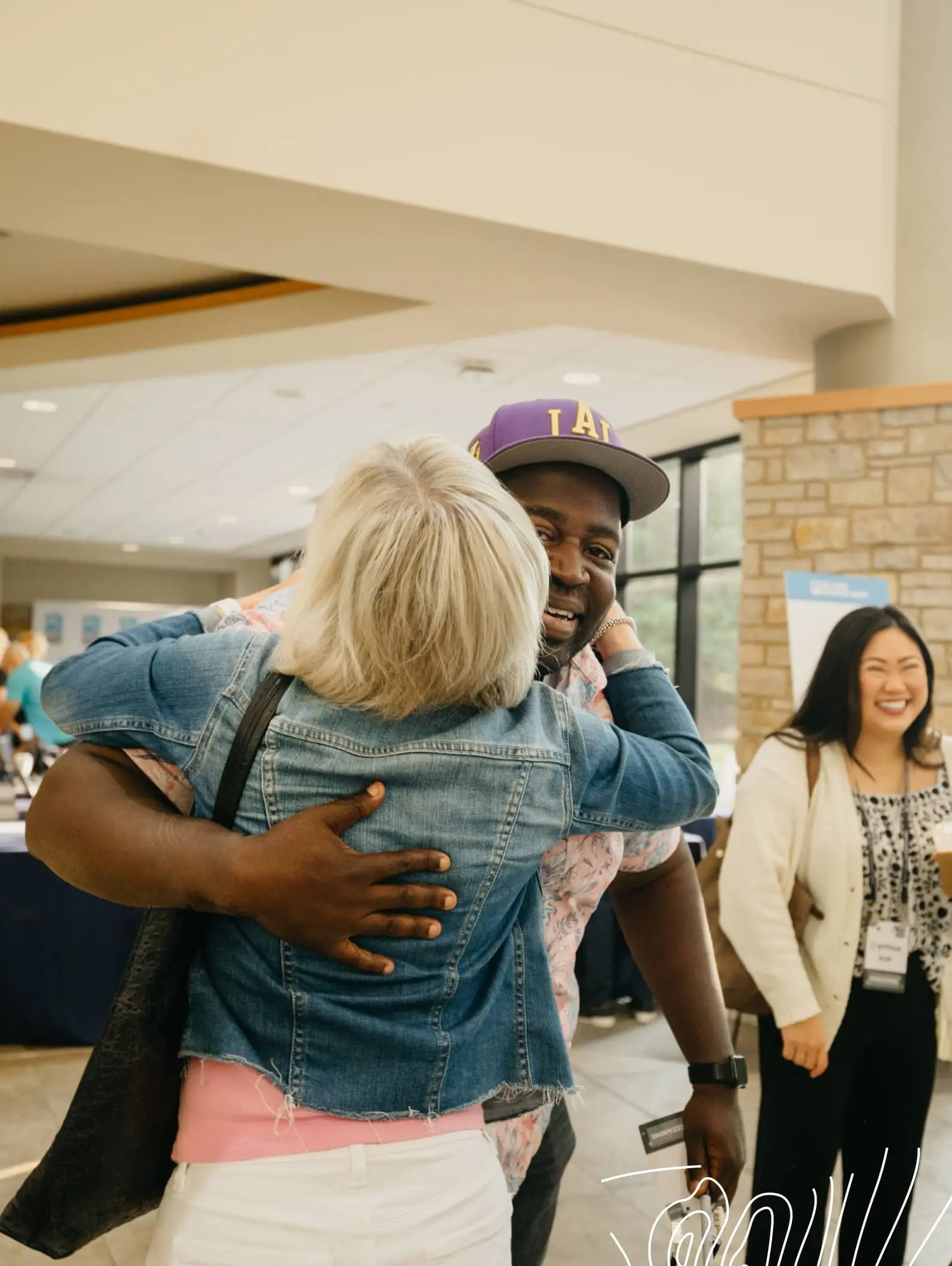 Man and woman hugging in open area