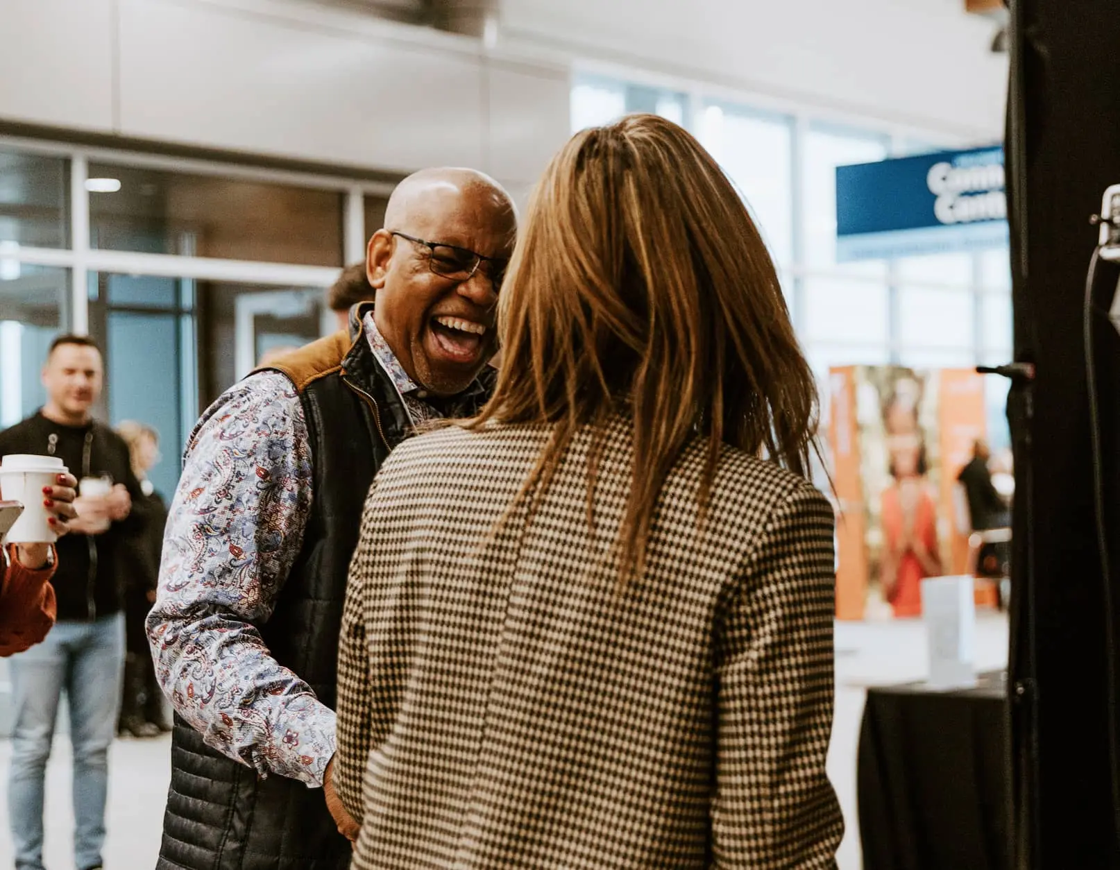 Man and woman laughing and conversing