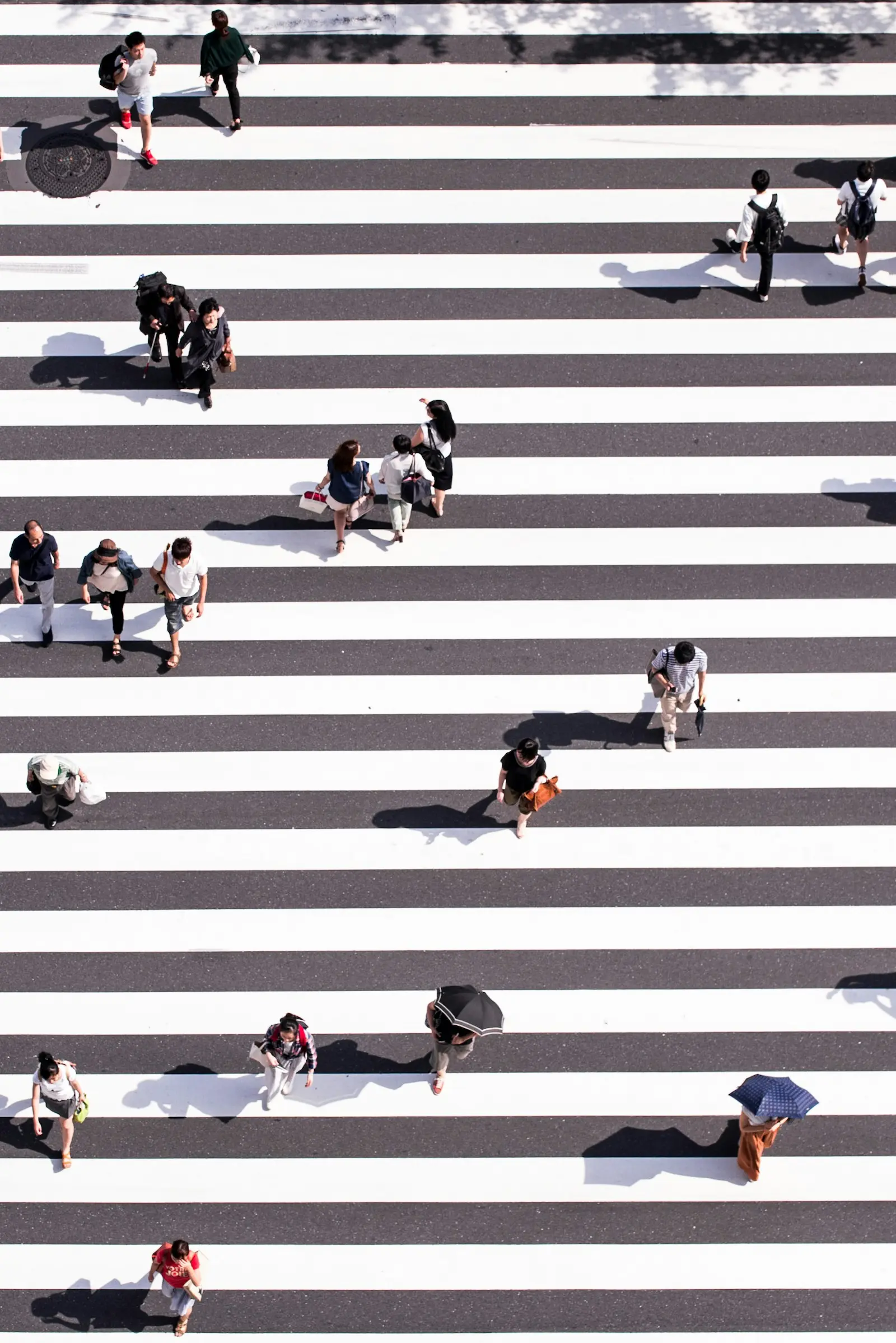 People walking across a crosswalk