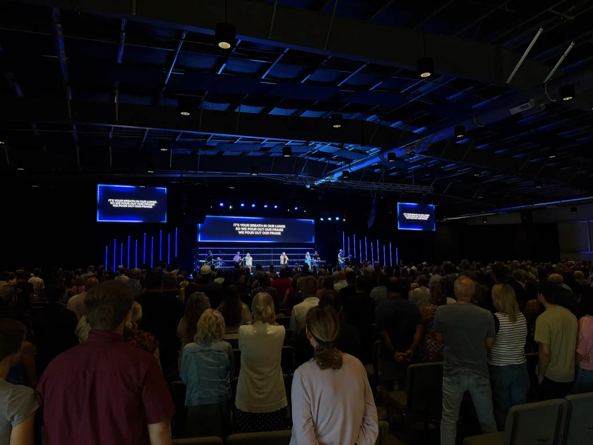 LED video wall installed at a church sanctuary displaying worship lyrics for a live service.