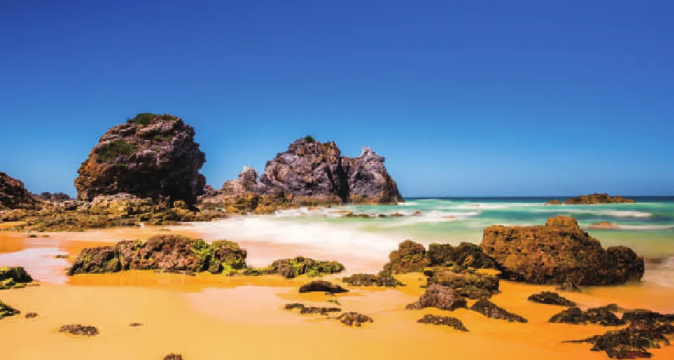 The same coastal rock formation on a CMG Visuals 1609E panel, with deeper blacks and richer sky tones