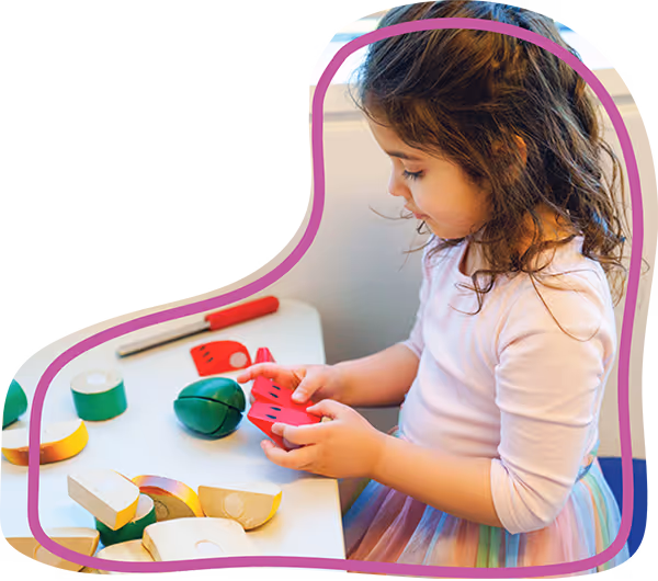 Pediatric therapy engaging in therapeutic play as part of a diagnostic evaluation