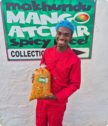Guy holding bag of Makhundu Bulk Atchar